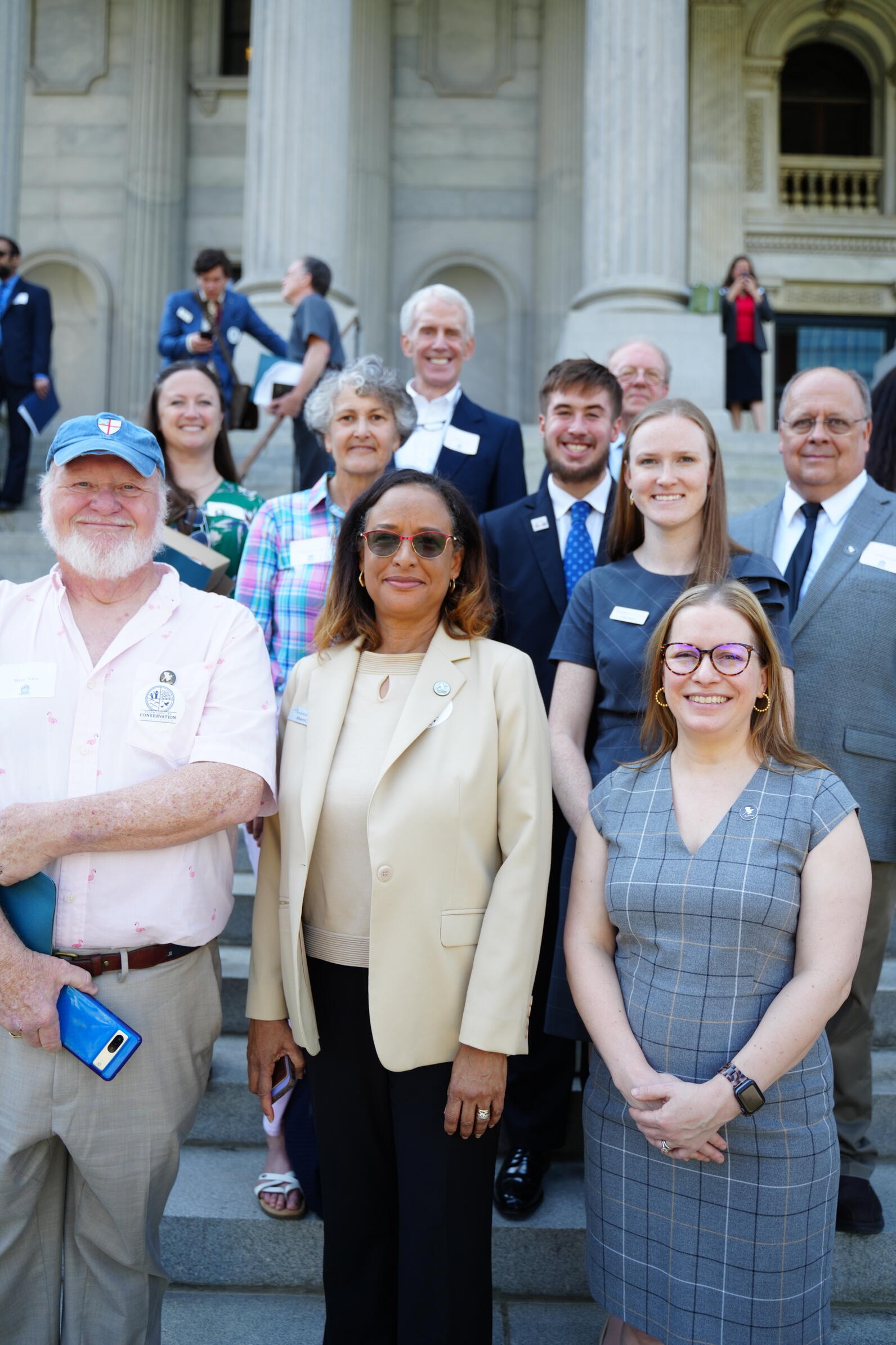 Audubon South Carolina Staff and advocates stand smiling on the steps of the South Carolina state house. 